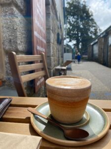 The interior of The Coffee Hut in Helston, highlighting the cozy and welcoming atmosphere where guests can enjoy coffee and conversation.